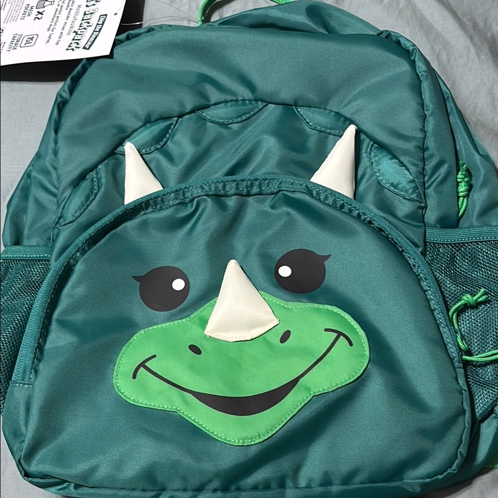 Green dinosaur backpack. Brand new with tags